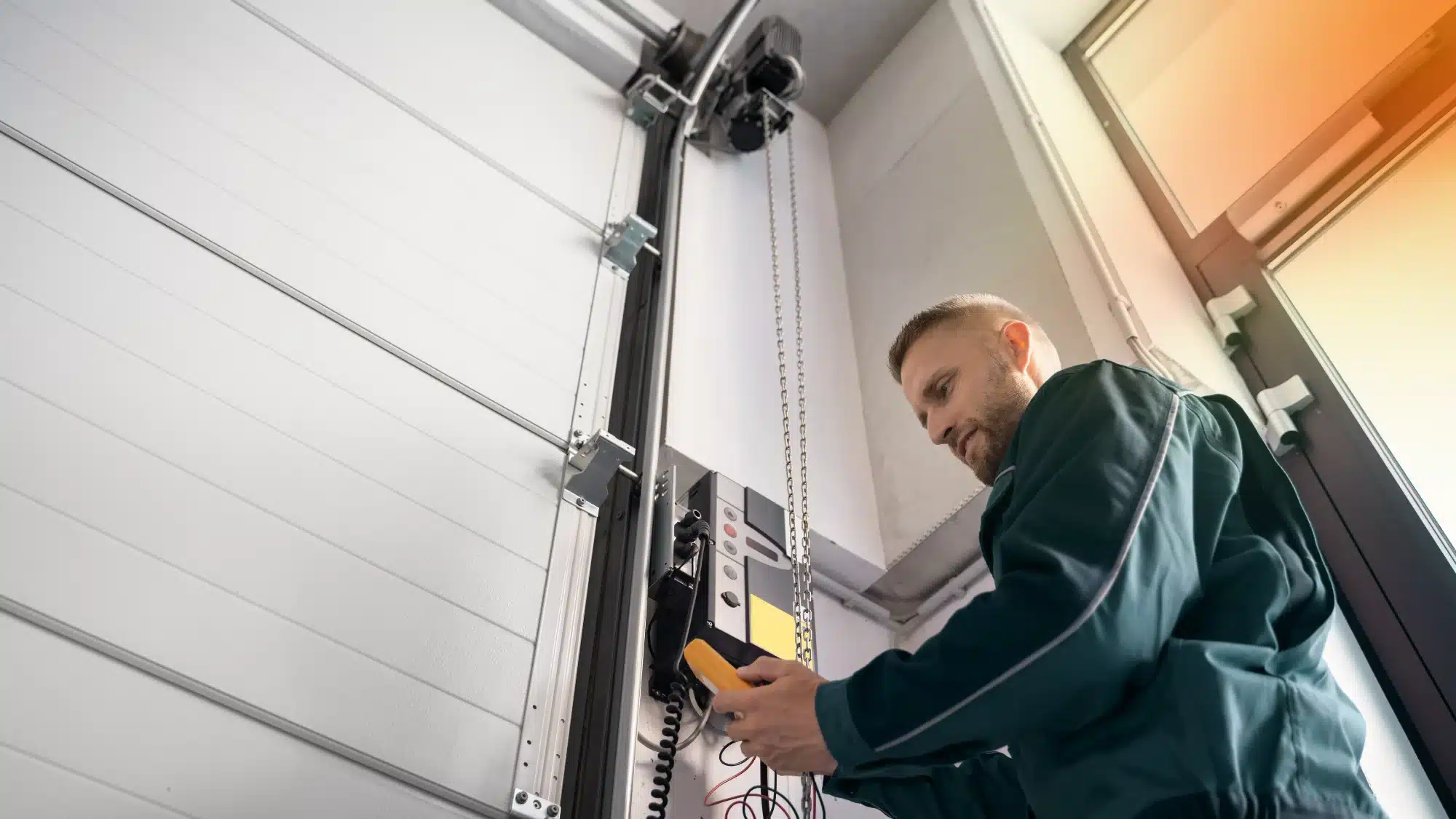 Technician fixing commercial door